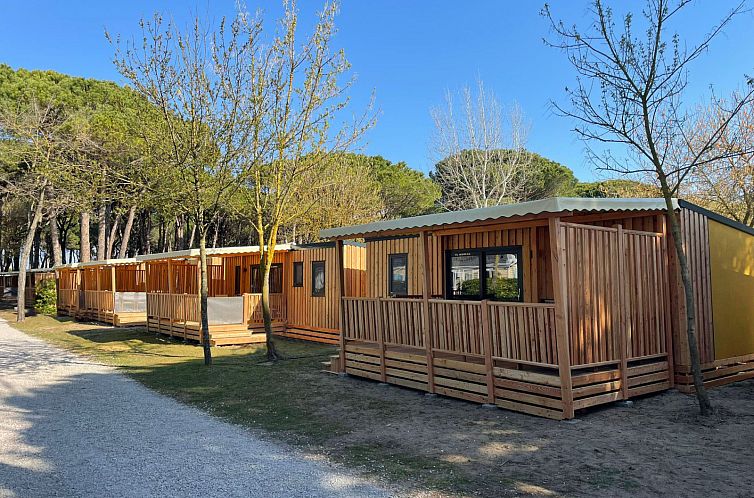 Vacation home SunLodge Babul in Venice, Italy, with charming wooden terraces and a serene wooded setting.