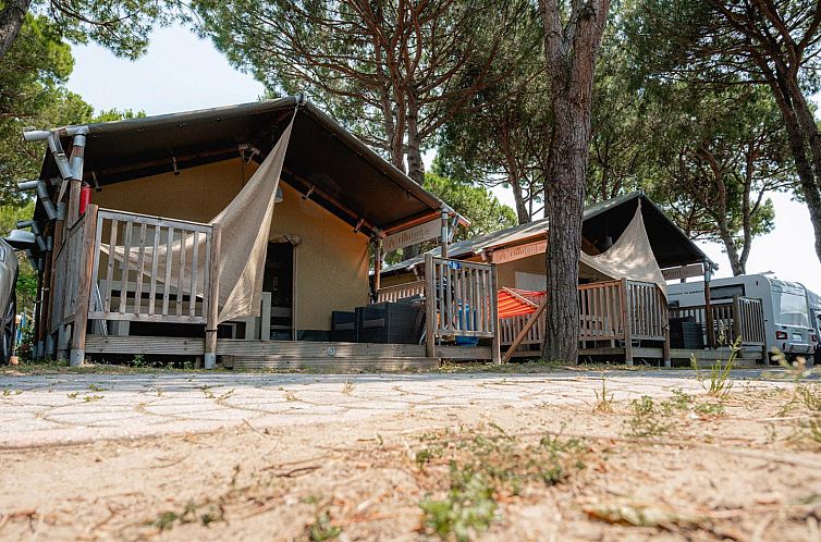 Glamping lodge Nomad in Cavallino, Venice, Italy with shaded terrace area.