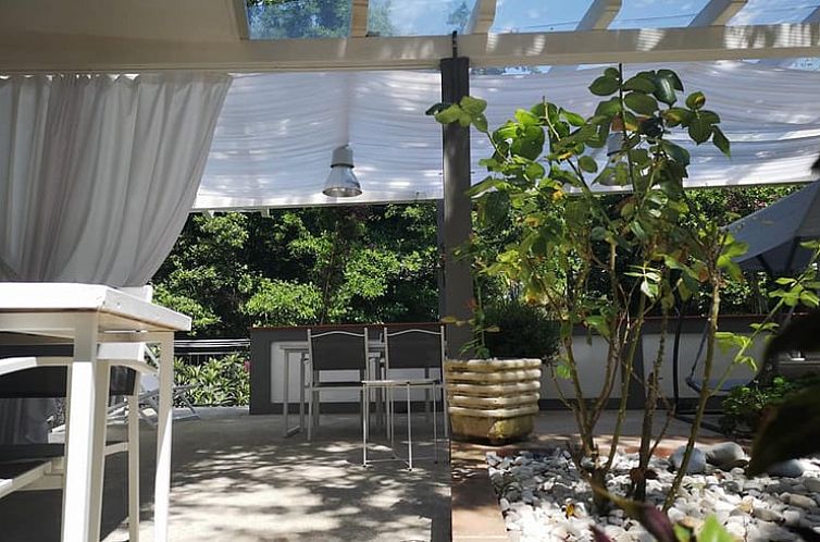 Enjoy tranquility on the terrace of Holiday Home in Buonvicino, surrounded by nature in Calabria, Italy.