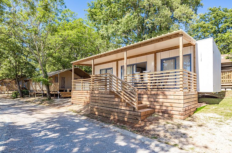 Cozy porch of Mobile home Pula, vacation home in Porec, surrounded by trees in Istria.