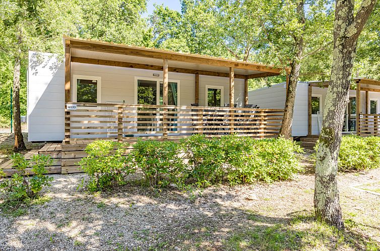 Enjoy the serene surroundings at Mobile home Fuskulin in Porec, Istria, with an inviting terrace and natural surroundings.