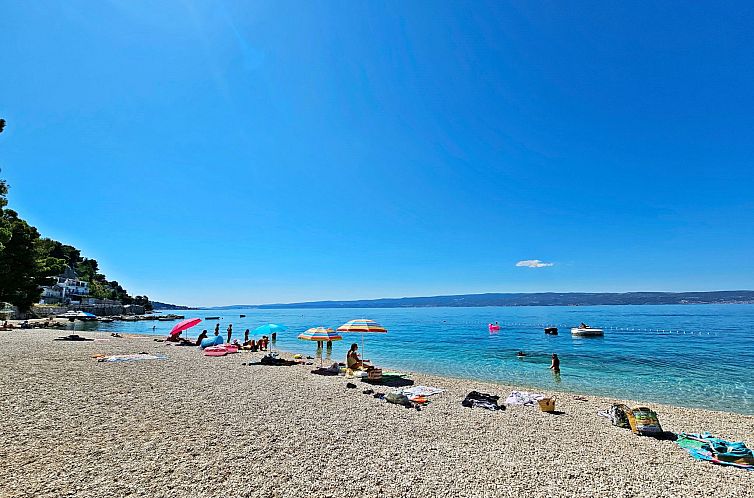 Appartement mit überdachter Terrasse und Balkon am Strand m