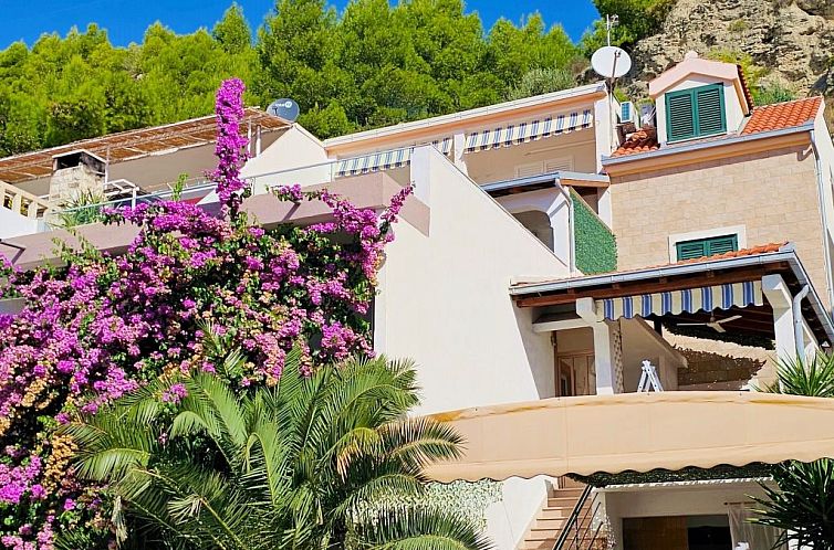 Appartement mit überdachter Terrasse am Strand mit Meerblic