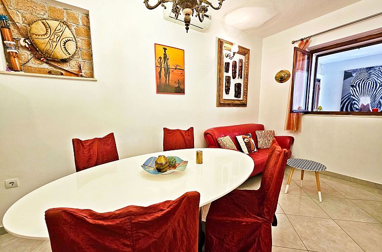 Appartement mit überdachter Terrasse am Strand mit Meerblic