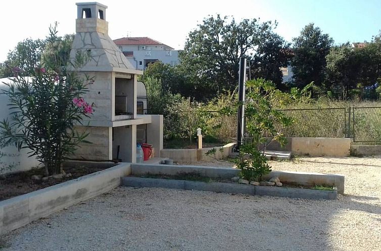 Vakantiehuis mit überdachter Terrasse und Meerblick