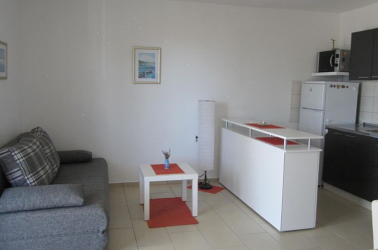 Vakantiehuis mit überdachter Terrasse und Meerblick