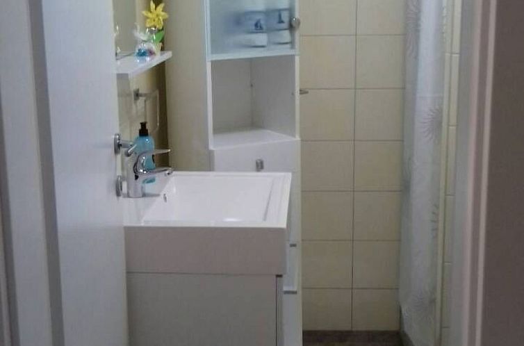 Vakantiehuis mit überdachter Terrasse und Meerblick