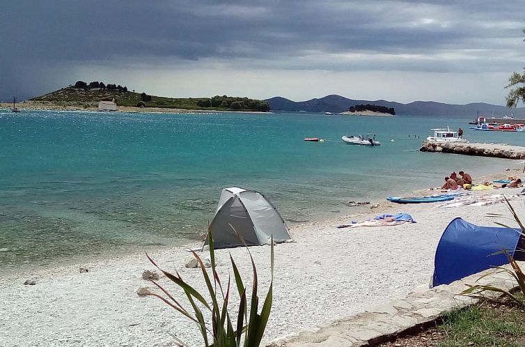 Vakantiehuis mit überdachter Terrasse und Meerblick