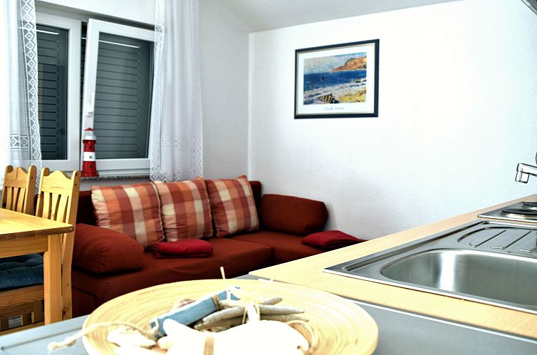 Appartement für vier Personen mit Balkon im ersten Obergesc