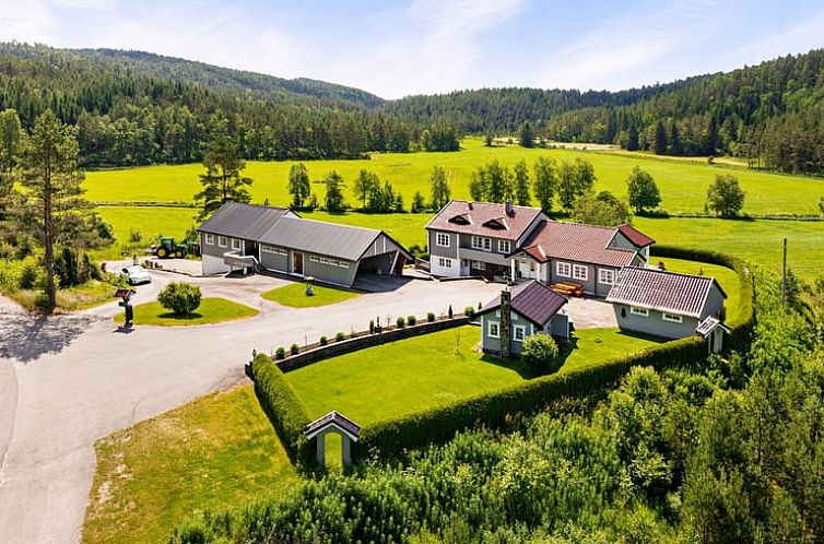 Cozy cottage in Bjelland, southern Norway, overlooking vast forests and fields.
