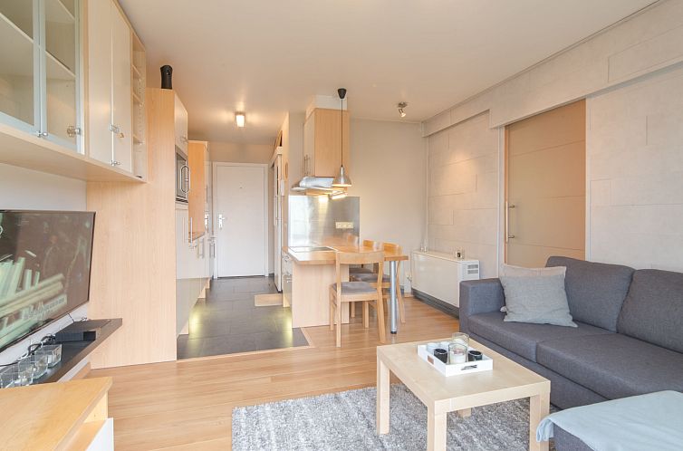 Cozy interior space of Apartment Firenze 011 in Bredene, Belgian coast, with comfortable sitting area and modern kitchen.