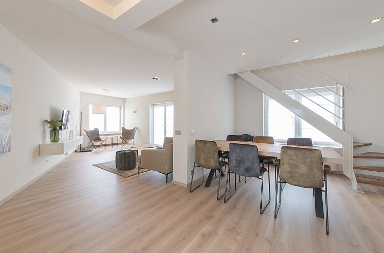 Stylish interior of Apartment Alaska Beach in Bredene, Belgian coast, with spacious living room and dining area for a relaxing stay.