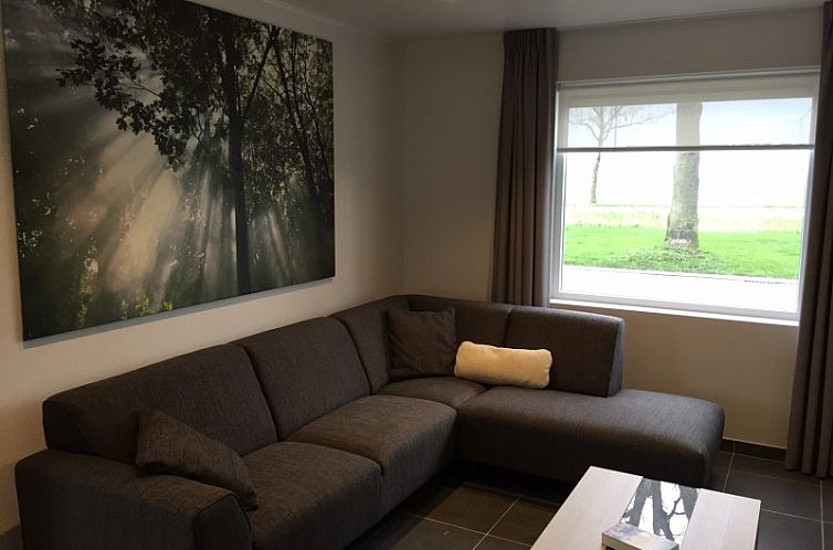 Cozy living room in Holiday home RUST, Middelkerke, Belgian coast, with comfortable sitting area and large window.