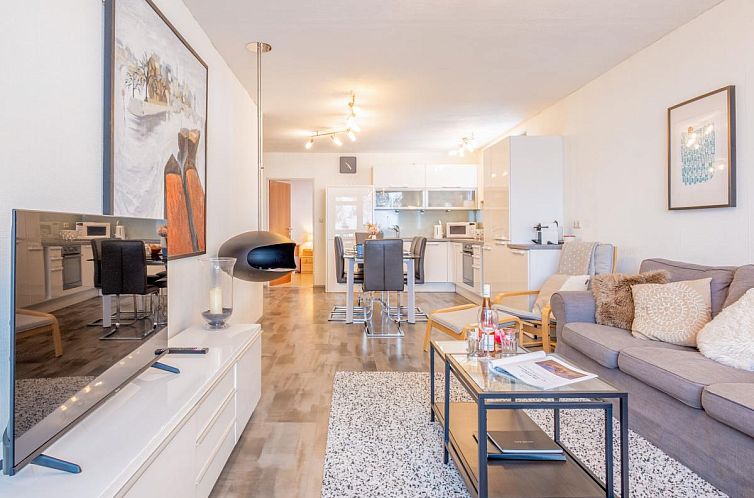 Gezellige woonkamer en keuken in My Mountain next door, een vakantiehuis in het schilderachtige Maria Alm, Salzburg.