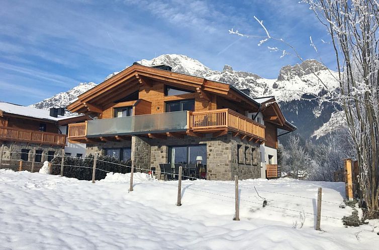 Enjoy the winter scenery at Chalet Anna XL Leogang, a charming vacation home in Salzburg.