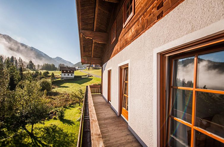 Indoor area of Pistenblick Forstau in Forstau, Salzburg, Austria, with cozy sitting area and dining room.