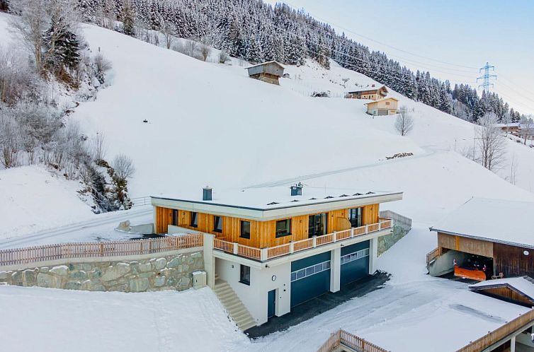 Sneeuwbedekt landschap bij Hoferlitzlhubgut vakantiehuis in Mittersill, Salzburg, ideaal voor een winterse ontsnapping.