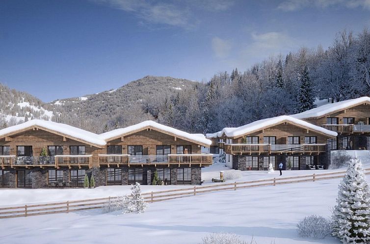 Attractive chalet Tauernlodge Amadeiro Im Pongau in the winter surroundings of Eben im Pongau, Salzburg, Austria.