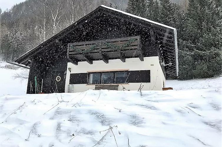 Snowy landscape around Jagerhutte in Mallnitz, Carinthia, perfect for a winter vacation in a chalet.