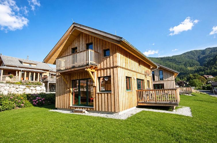Vacation home Gipfelzauber in Austria, Hohentauern, with wooden veranda and snowy landscape.