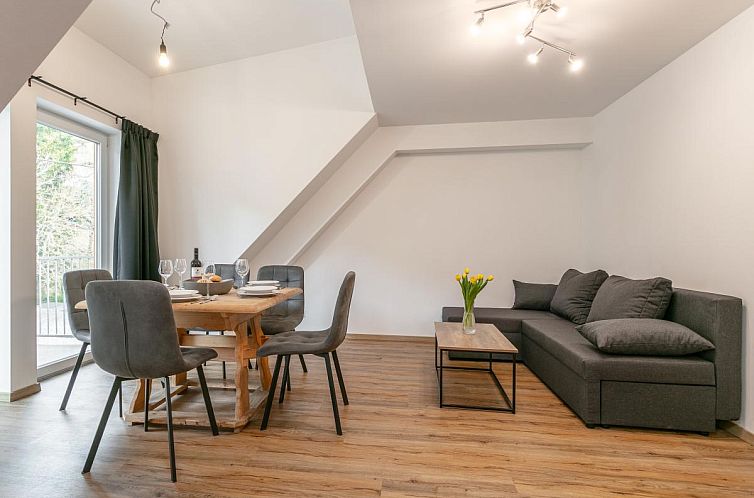 Gemuetliches Wohnzimmer des NRV Top 6 Ferienhauses in Moederbrugg, Steiermark, ideal fuer entspannte Abende.