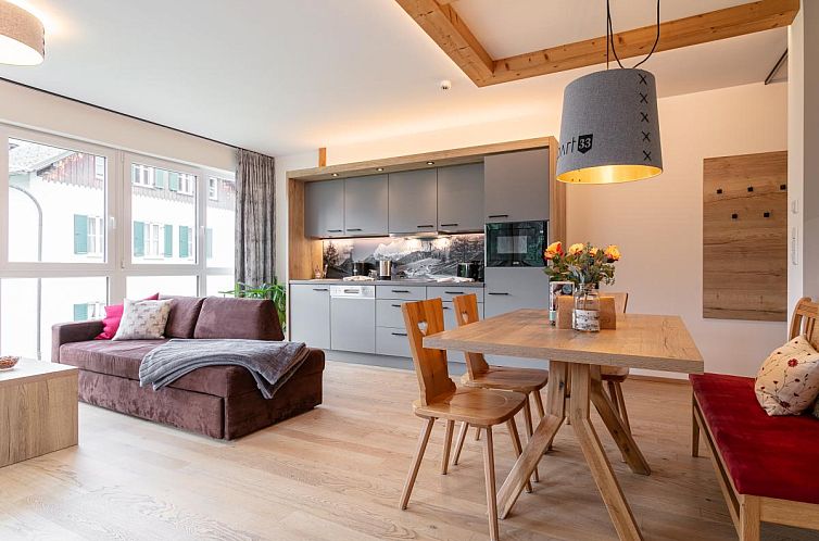 Lichte leefruimte van Apart33 Top 1-22 in Haus im Ennstal, Steiermark, vakantiehuis met stijlvol design en comfortabele zithoek.