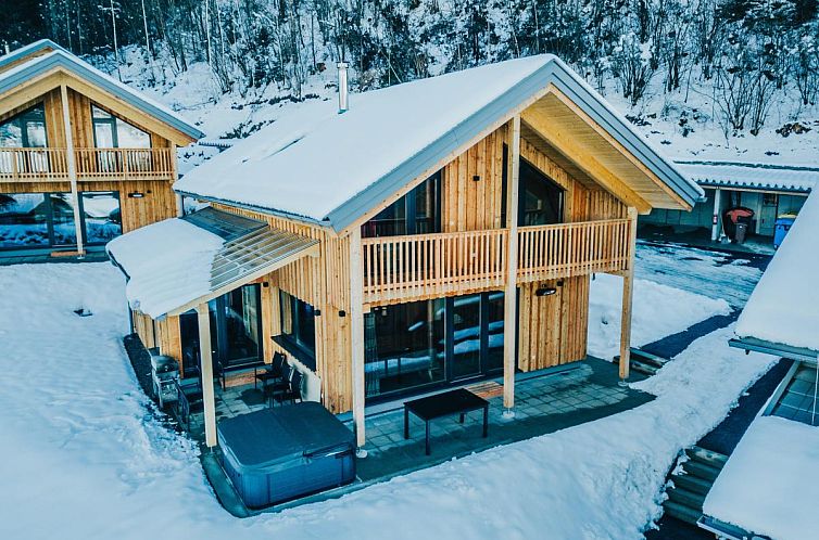 Chalet Kreischberg W18 surrounded by snow in Sankt Georgen am Kreischberg, Styria, Austria, ideal for a winter vacation.