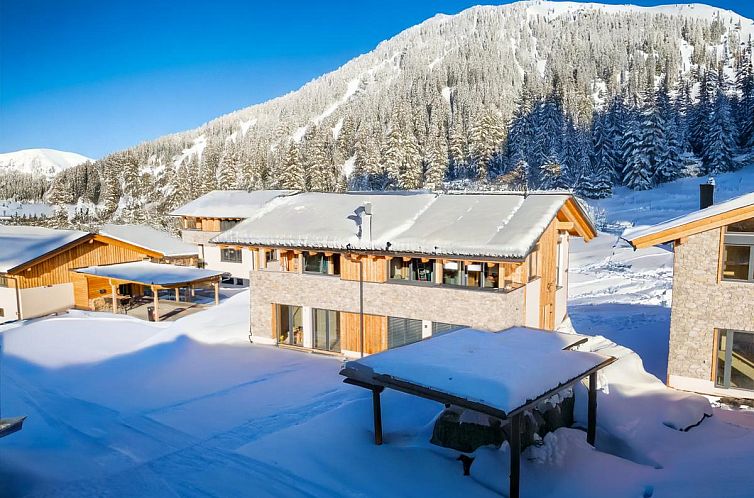 Winter scenery around Grebenzen Lodge Edelweiss, vacation accommodation in Sankt Lambrecht, Styria, with stunning mountain views.