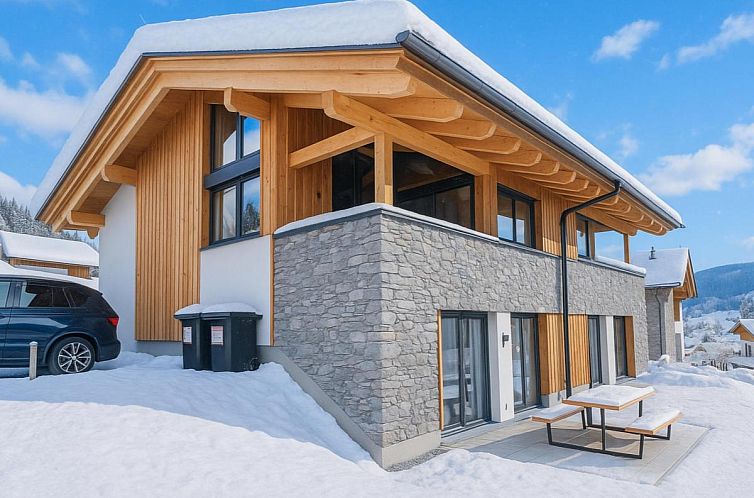 Charming vacation home Gipfelgluck in Sankt Lambrecht, Austria, featuring winter mountain surroundings.