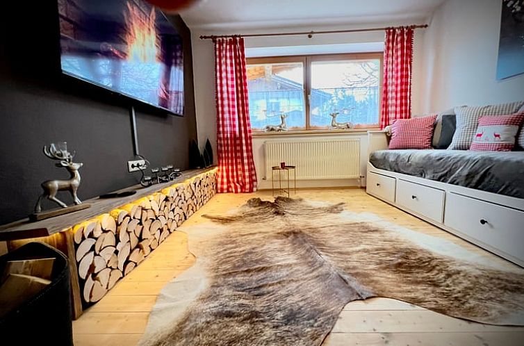 Interior of Cottage in Stumm, Tyrol, Austria with cozy atmosphere and natural light.