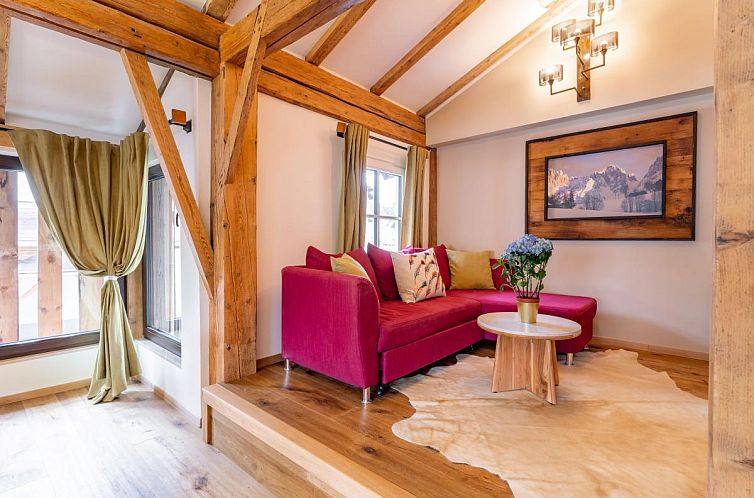 Interior of Biber Art Apartment 1 Small in Biberwier, Tyrol, featuring a cozy seating area and wooden interior.