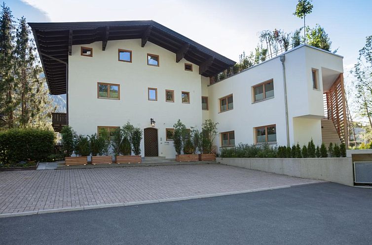 Discover the vacation home Kitz Apartments Top 6 in Kitzbuhel, Tyrol, surrounded by the serene nature of Austria.