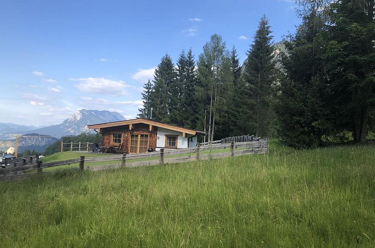 Cozy vacation home Schneeberghutte in Thiersee, Tyrol, with stunning views of snowy landscapes.