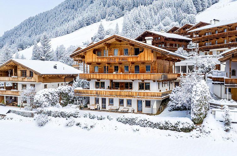 Snowy landscape at Haus Fernwald, a vacation home in Alpbach, Tyrol, with panoramic mountain views.