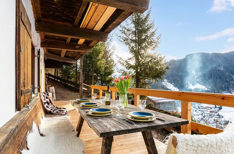 Relax on the terrace of Sonnenhutte unten in Hopfgarten im Brixental, Tyrol, with stunning mountain views.