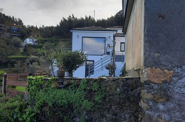 Rustic bedroom of Cottage in Pedorido Castelo De Paiva, vacation home in Beiras, Portugal. Relaxed atmosphere and modern comforts.