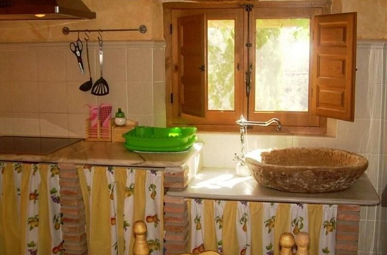 Vakantiehuis Haus mit integrierter Felswand und Jacuzzi