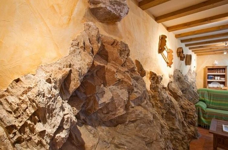 Vakantiehuis Haus mit integrierter Felswand und Jacuzzi