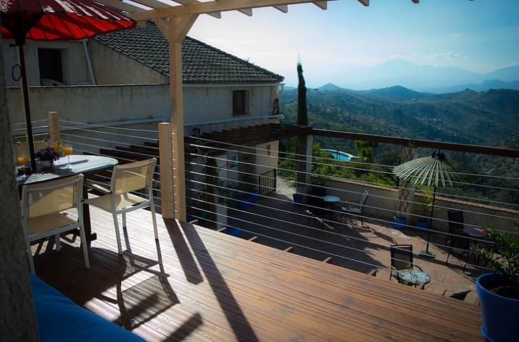 Relax on the veranda of Holiday Home in Alora with beautiful views over the hills of Alora, Andalusia, Spain.