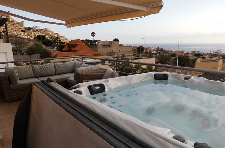 Relax in the jacuzzi overlooking the sea at Casa Alex, a charming bed and breakfast in Adeje, Canary Islands.