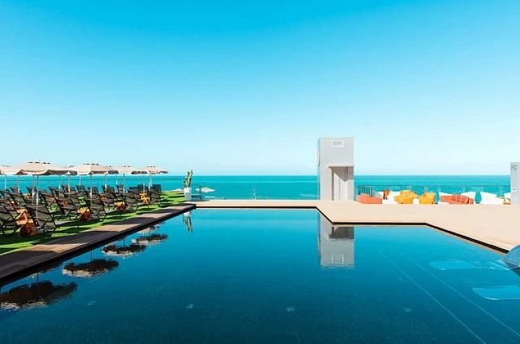 Relax by the pool with panoramic sea views at Apartments Riviera Vista, Playa del Cura, Canary Islands.