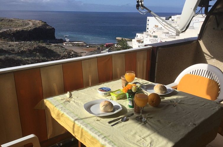 Terrace by Aquaviva vacation accommodation in Callao Salvaje, Spain, offers picturesque ocean views during breakfast.