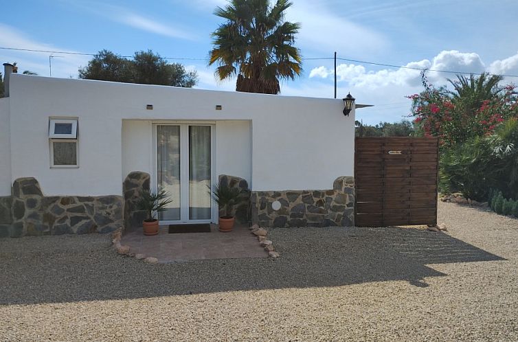 Cozy Casita Fuente in El Altet, Costa Blanca, vacation home with sunny terrace and serene surroundings.
