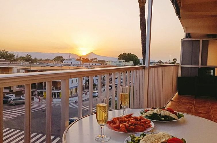 Relax on the balcony of Sunny Balcony in Oliva, Costa Blanca, and admire the sunset views from the apartment.