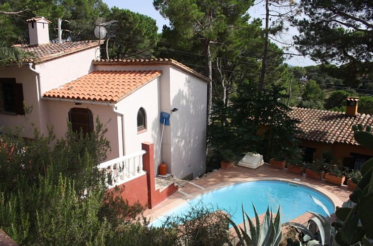 Enjoy the serene Surya vacation home in Begur, Costa Brava, complete with a refreshing pool and lush surroundings.