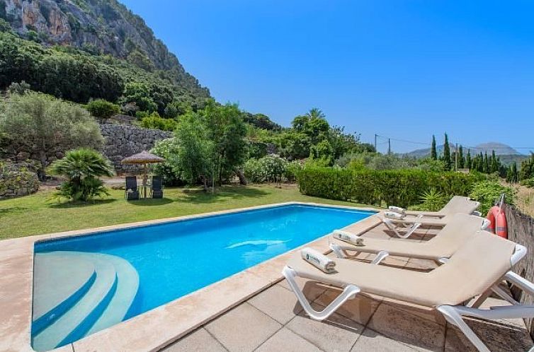 Relax by the pool at Villa Coster de Puig, a charming vacation home in Pollensa, Mallorca.