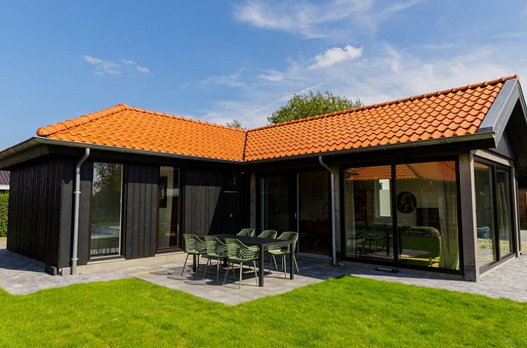 Vacation home in Eanjum, located in picturesque Anjum, offers a modern look with a terrace and green garden.