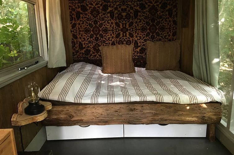 Cozy bedroom in Cottage in Orvelte, Middle Drenthe, Drenthe with rustic decor and natural light.