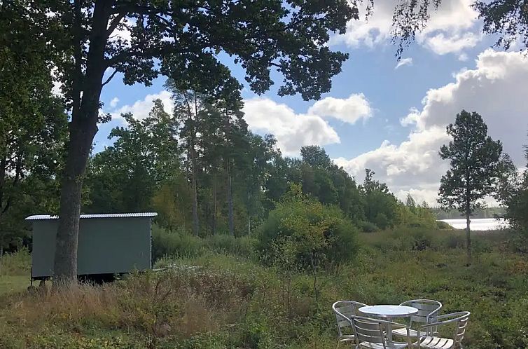 Tuinhuis met uitzicht op meer