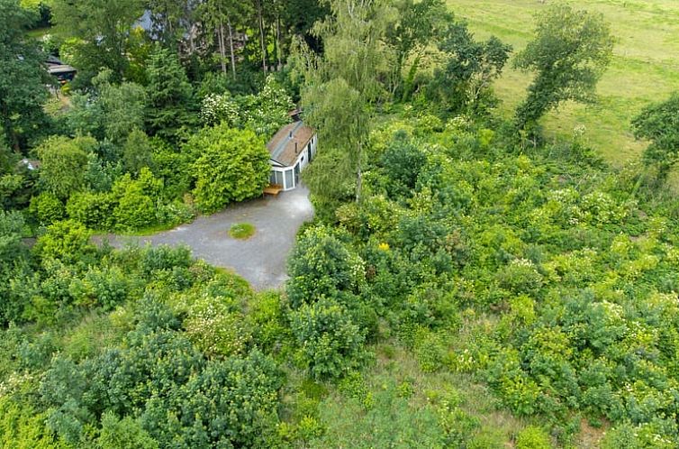 Aerial photo of Cottage in Ees, vacation home surrounded by greenery in North Drenthe, Drenthe.